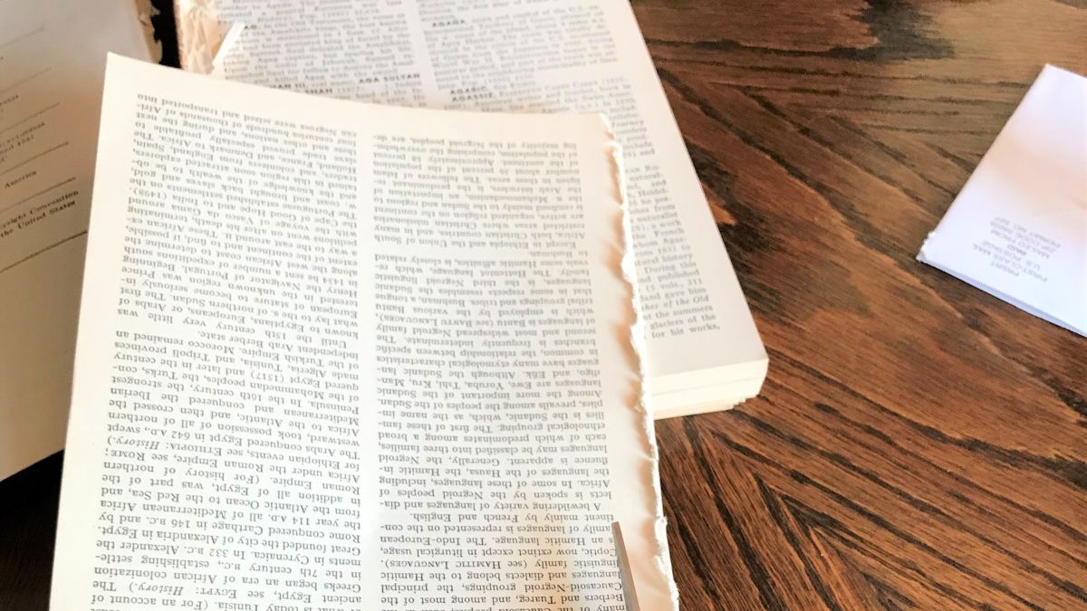 Woman Rolls Old Book Pages to Create a One-of-a-Kind Wreath